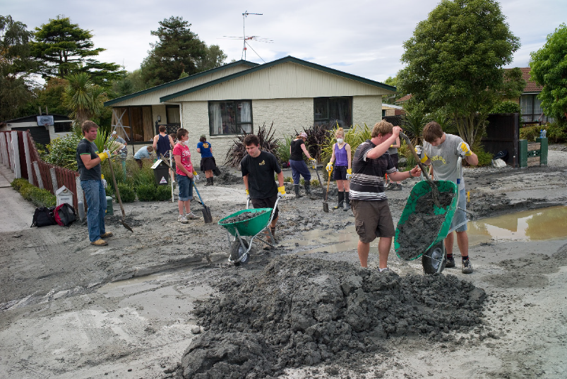 Student Volunteer Army volunteers cleaning up silt in Christchurch, 2011. Image: Student Volunteer Army digital archives, accessed 20 August 2018