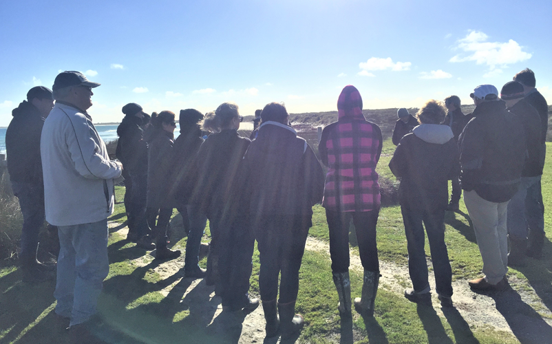 Members of the Chatham Island community gathered for a karakia and story sharing at Waitangi West. Image: Lucy Kaiser